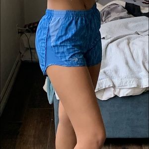 Blue Nike running shorts